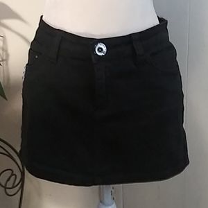 A black silver studded mini skirt